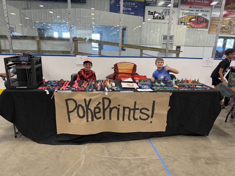 Young vendor selling handmade bead bracelets at the Kids Mini Market at Prairie Harvest Fest